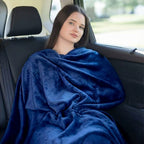 OSO Comfort Flight Set with memory foam pillow, travel blanket and eye mask arranged on neutral surface