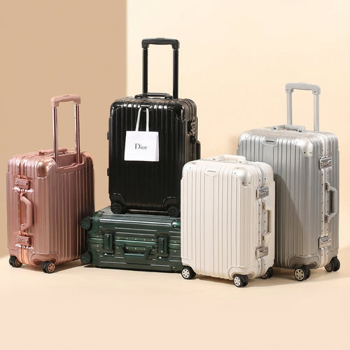 Silent spinner wheels and reinforced corners on Sterling Silver suitcase