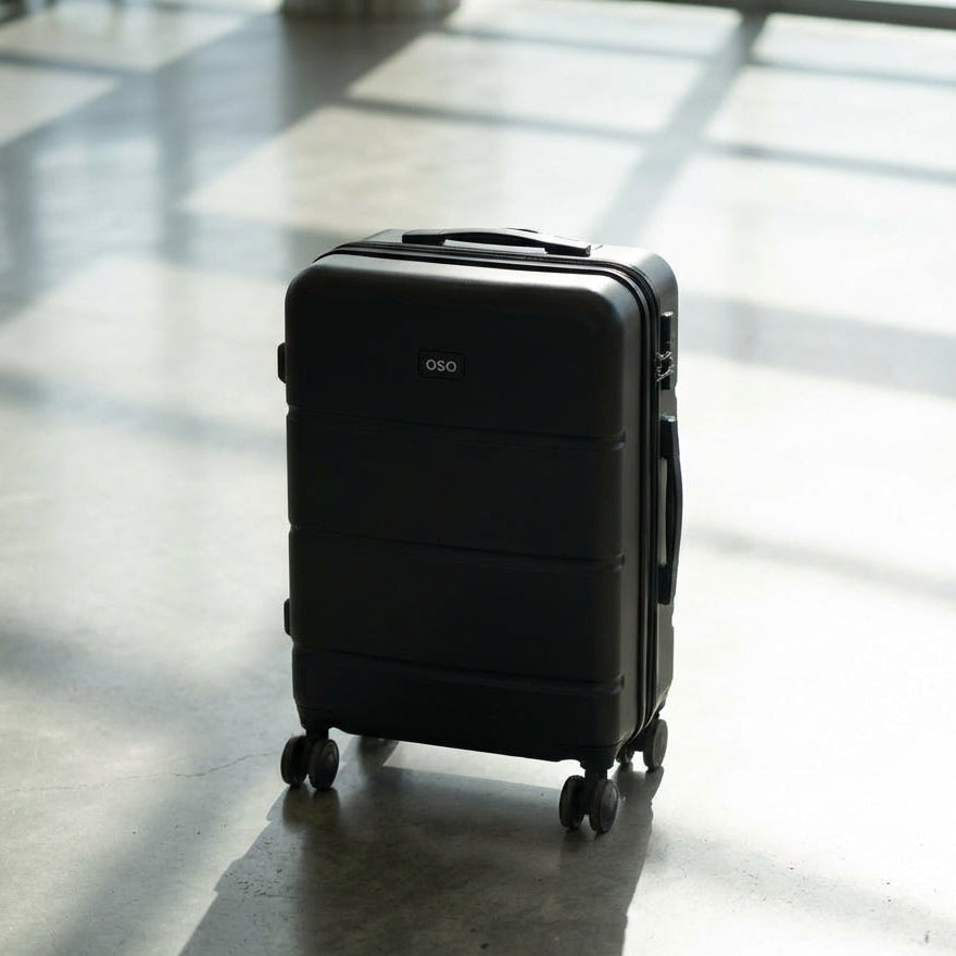 Front-access compartment open on hybrid carry-on showing laptop space