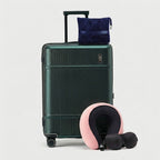 Travel comfort accessories including memory foam pillow, blanket, and eye mask in muted tones