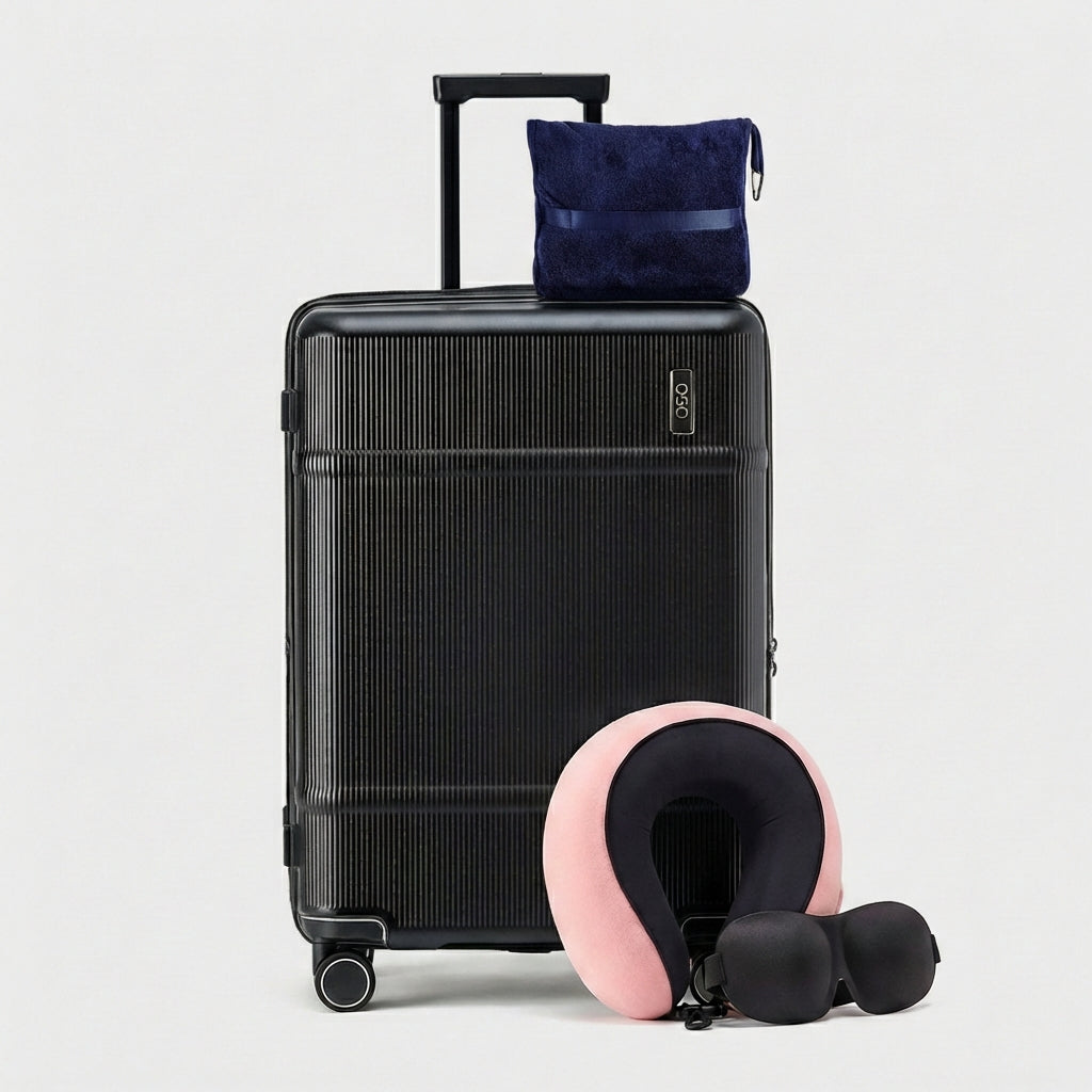 Travel comfort accessories including memory foam pillow, blanket, and eye mask in muted tones